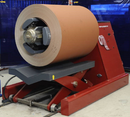 The decoiler feeds the steel coil into the rollformer