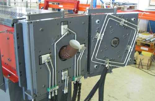 Round downspout tube with elbow coming out of the rollformer